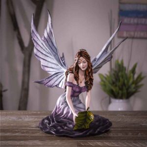 Playful Purple Fairy with Leaf Statue